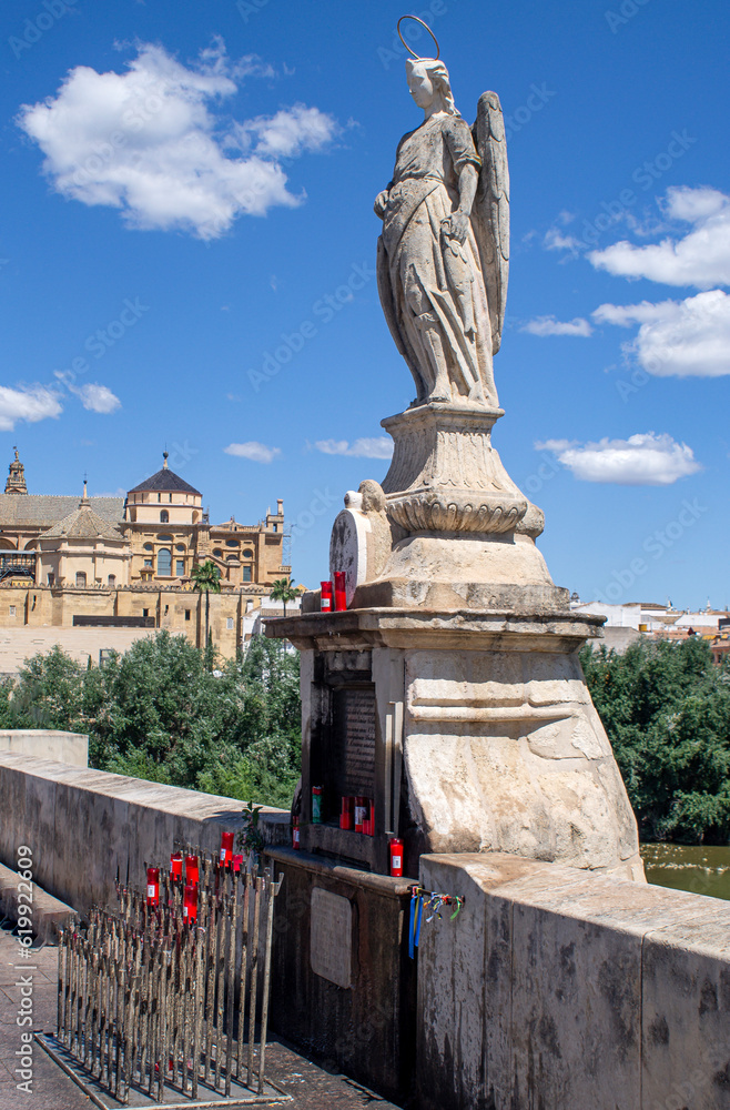 Angel San Rafael statue with views of the cathedral, Cordoba, Spain