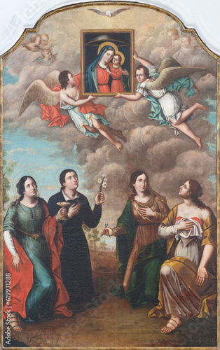 POLIGNANO A MARE, ITALY - MARCH 4, 2022: The painting of holy martyrs Lucia, Margaret, Apollonia and Agtha in the Cathedral Matrice by Francesco Candela (1848). photo