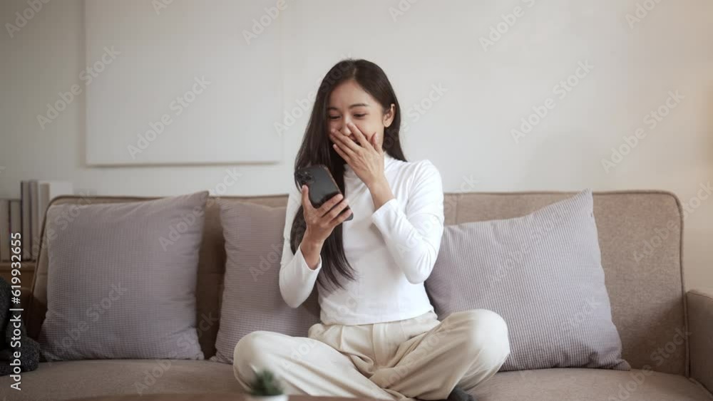 Happy Asian woman using smartphone and Excited. Happy Asian woman using smartphone and Excited.