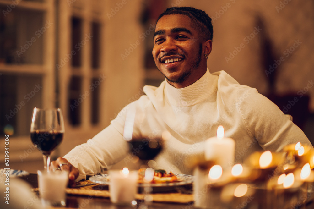 Smiling african american man having a romantic date with his girlfriend at home
