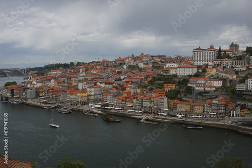 Fototapeta Naklejka Na Ścianę i Meble -  The City of the Porto (Oporto), the second largest city in Portugal located on the River Douro, with barges carrying Port (fortified wine)