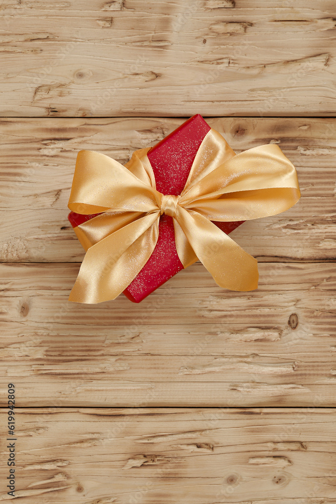 Red box with a large golden bow, handmade. Beautiful gift for your girlfriend. Red box with a large golden bow, handmade. Beautiful gift for your girlfriend.
