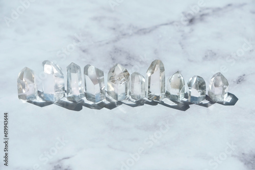 clear quartz minerals crystal towers close up on abstract marble background. set of gemstones for healing Crystal Ritual, esoteric spiritual practice. Witchcraft. relax, meditation, life balance