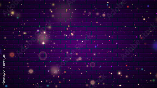 Glittering fairy dust particles. Purple sparks and stars shine with a special light effect on a brick background.