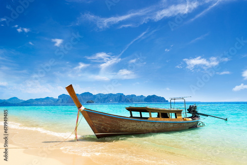 long tail boat on tropical beach