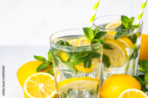 Lemonade in glass on white table.