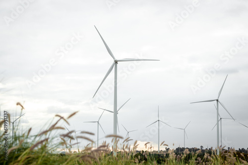 Wind Turbines Windmill Energy Farm. windmill wind turbines in field. Wind turbines power generator electric.