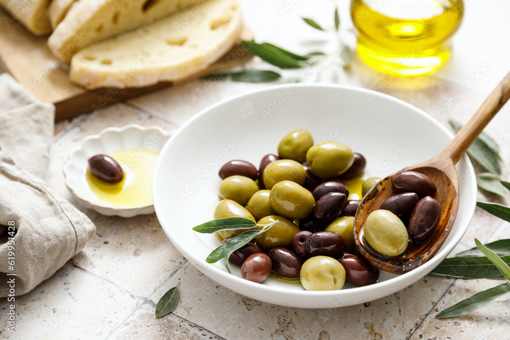 Olives, ciabatta and olive oil in a bottle Olives, ciabatta and olive oil in a bottle