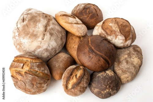 variety of bread types arranged on a clean white surface