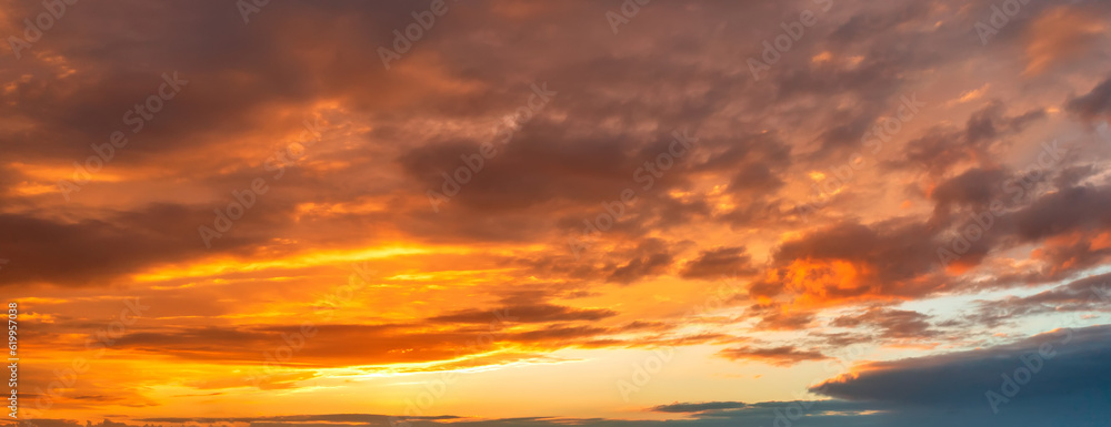 Dramatic colorful clouds in the sky. Panoramic view..