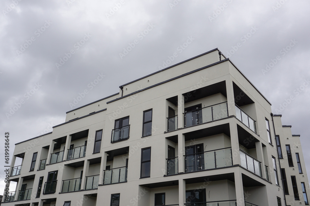 New apartment block in residential area of city. New housing development New apartment block in residential area of city. New housing development