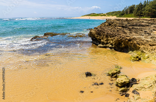 Waves Crash Over Exposed Coral Reef on Kawailoa Bay Beach, Mahaulepu Heritage Trail, Poipu, Kauai, Hawaii, USA photo