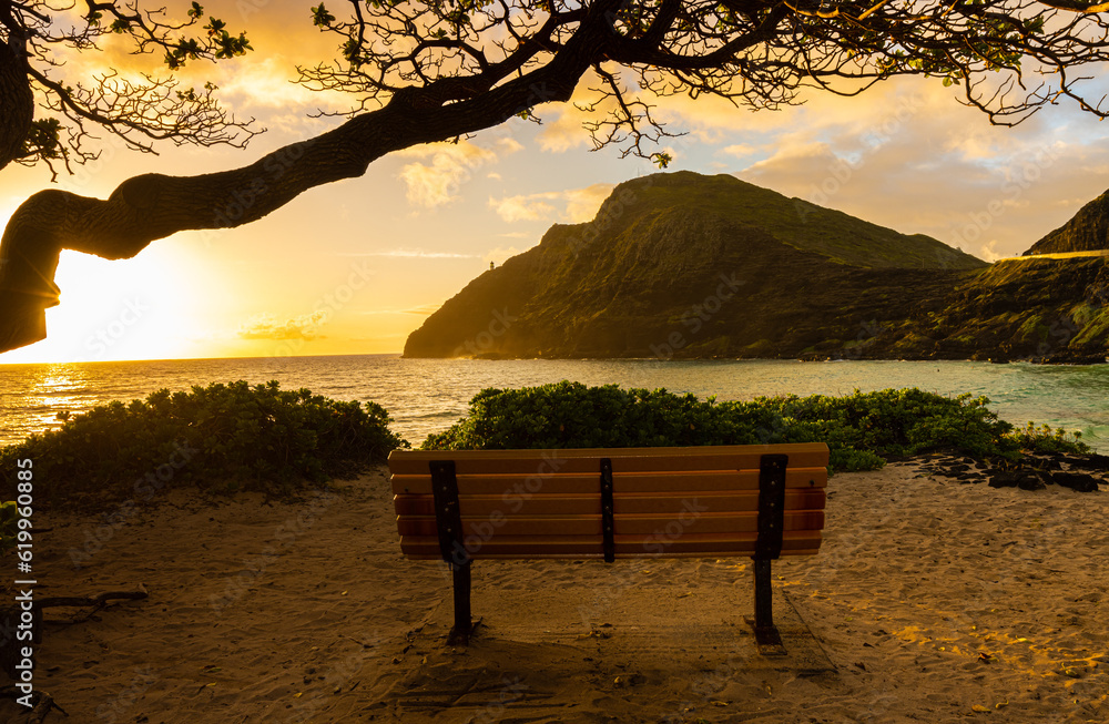 Wooden Bench Overlooking  Shoreline of Makapu'u Beach With Makapu'u Point In The Distance, Oahu, Hawaii, USA