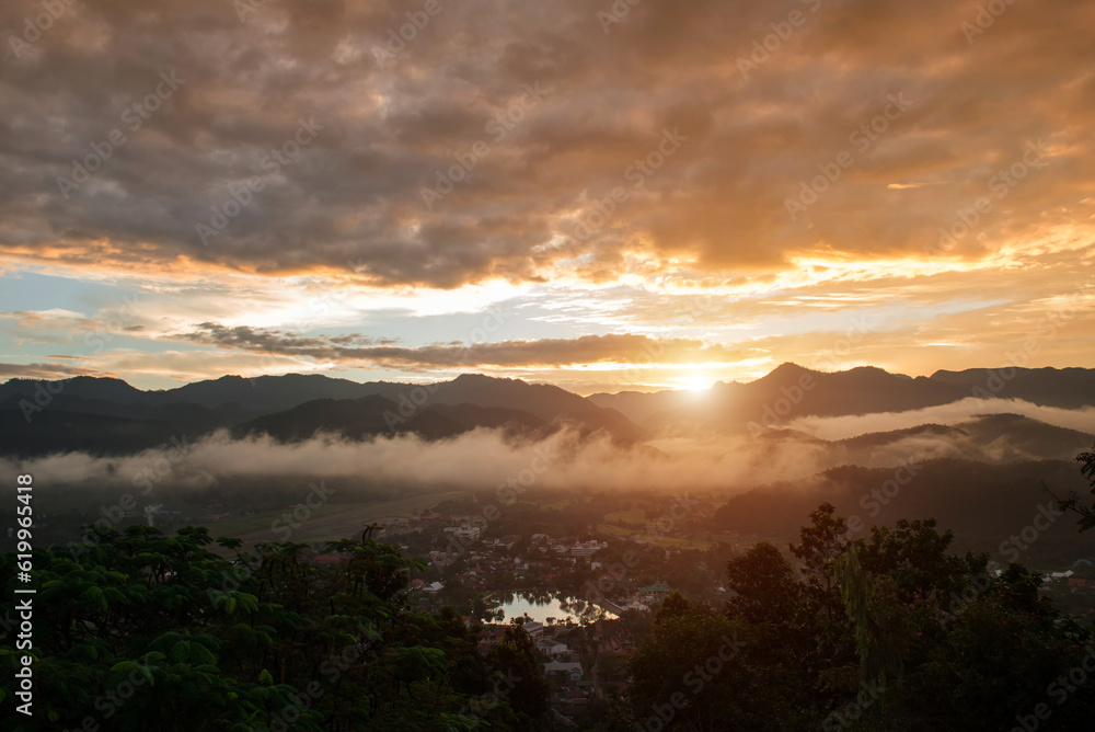 Sunset and mountain and town Sunset and mountain and town