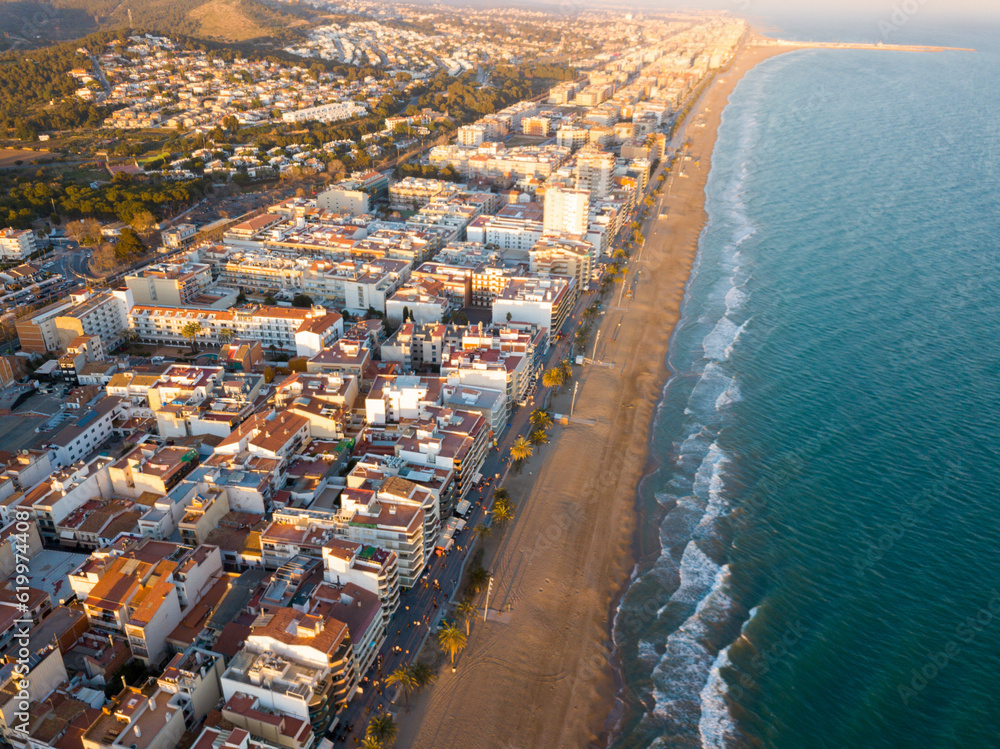 Aerial view of coast at Calafell cityscape with a modern apartment buildings, Spain