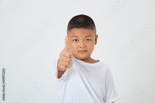 kids boy wearing a casual t-shirt standing isolated white background
