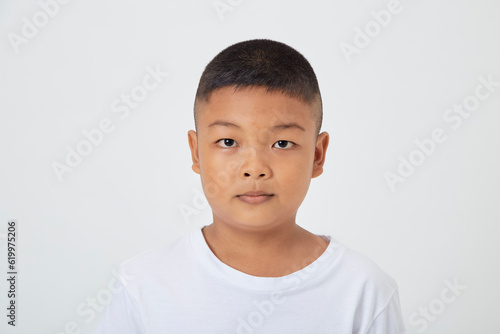 kids boy wearing a casual t-shirt standing isolated white background