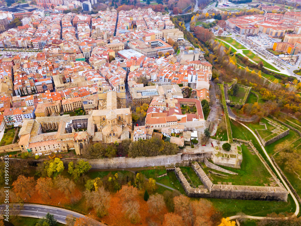 Aerial view of historic centre of Spanish city of Pamplona on bank of Arga river in autumn day