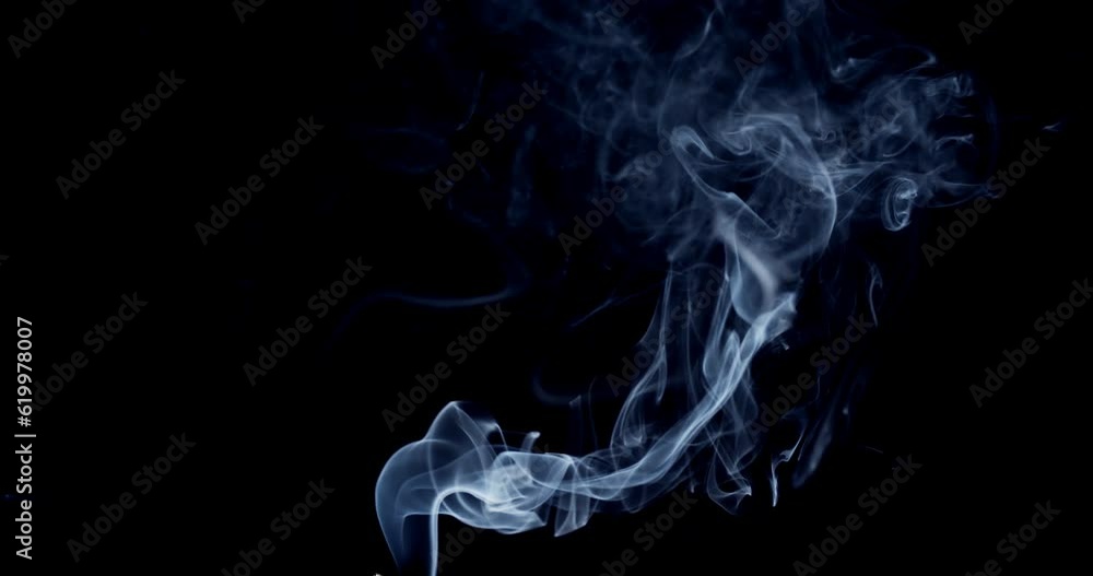 Real smoke on a black background. Thin Flexible Trickle of Real Smoke. Colorful real smoke rises up. Ideal for background or over-layer with blending mode add, screen, lighten. Real smoke on a black background. Thin Flexible Trickle of Real Smoke. Colorful real smoke rises up. Ideal for background or over-layer with blending mode add, screen, lighten.