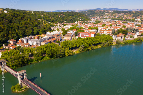 Picturesque view from drone of Givors summer cityscape on Rhone riverbanks, Auvergne-Rhone-Alpes region, France. photo