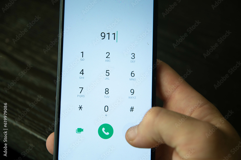 911 call smart phone hand holding 911 call smart phone hand holding