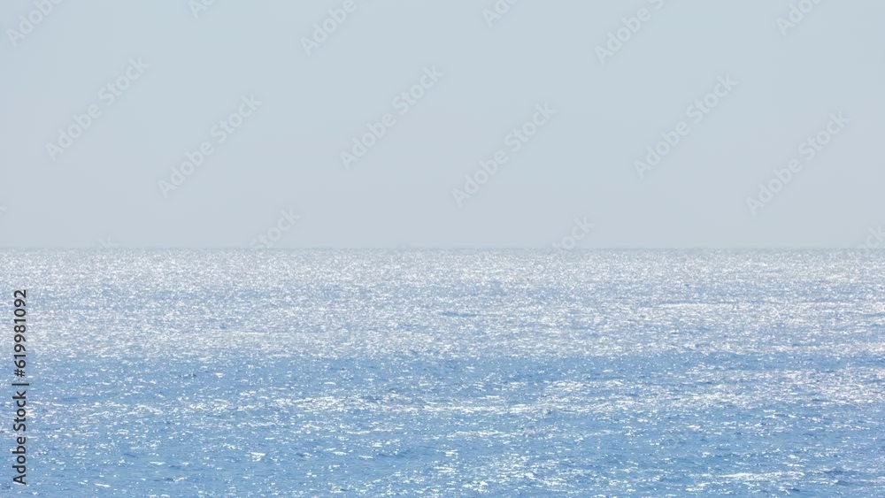 Blue Glittering Ocean and Bright Sky on a Sunny Summer Day Blue Glittering Ocean and Bright Sky on a Sunny Summer Day