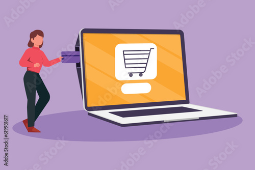 Cartoon flat style drawing young woman inserting credit card into big laptop screen with shopping cart inside. E-commerce, digital payment and online store concept. Graphic design vector illustration