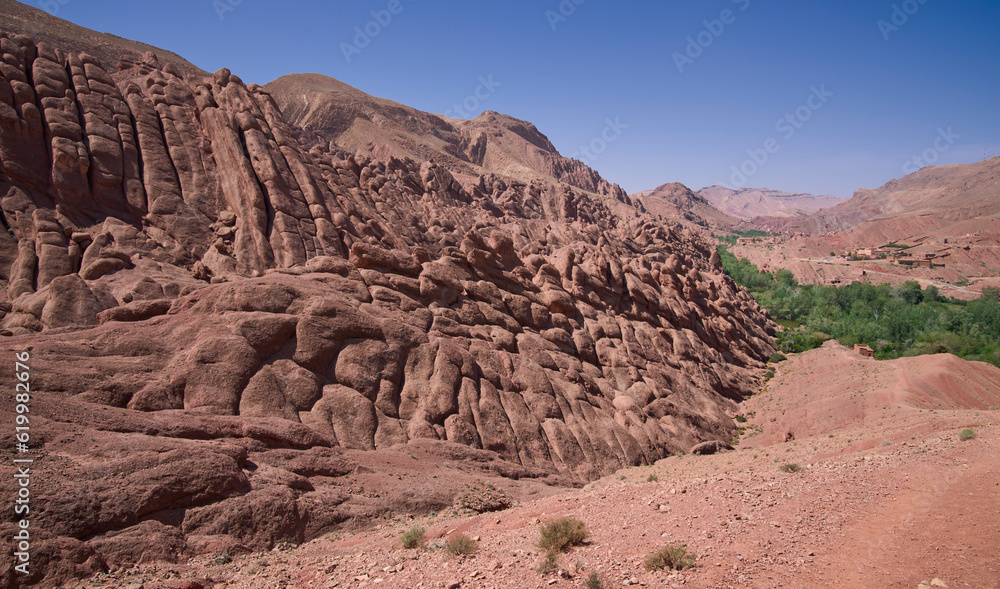 Mountain ridge called Monkey Fingers or Monkey paws in Dades gorge, Atlas Mountains, Morocco. Rocks that look like fingers rising from the earth. Unique walking trail in oasis in the Atlas Mountains. Mountain ridge called Monkey Fingers or Monkey paws in Dades gorge, Atlas Mountains, Morocco. Rocks that look like fingers rising from the earth. Unique walking trail in oasis in the Atlas Mountains.
