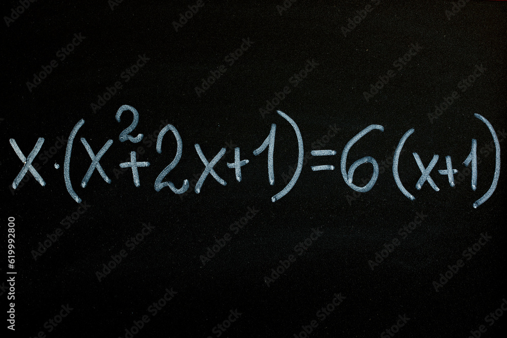 Fototapeta premium Quadratic equation draw by white chalk on blackboard background