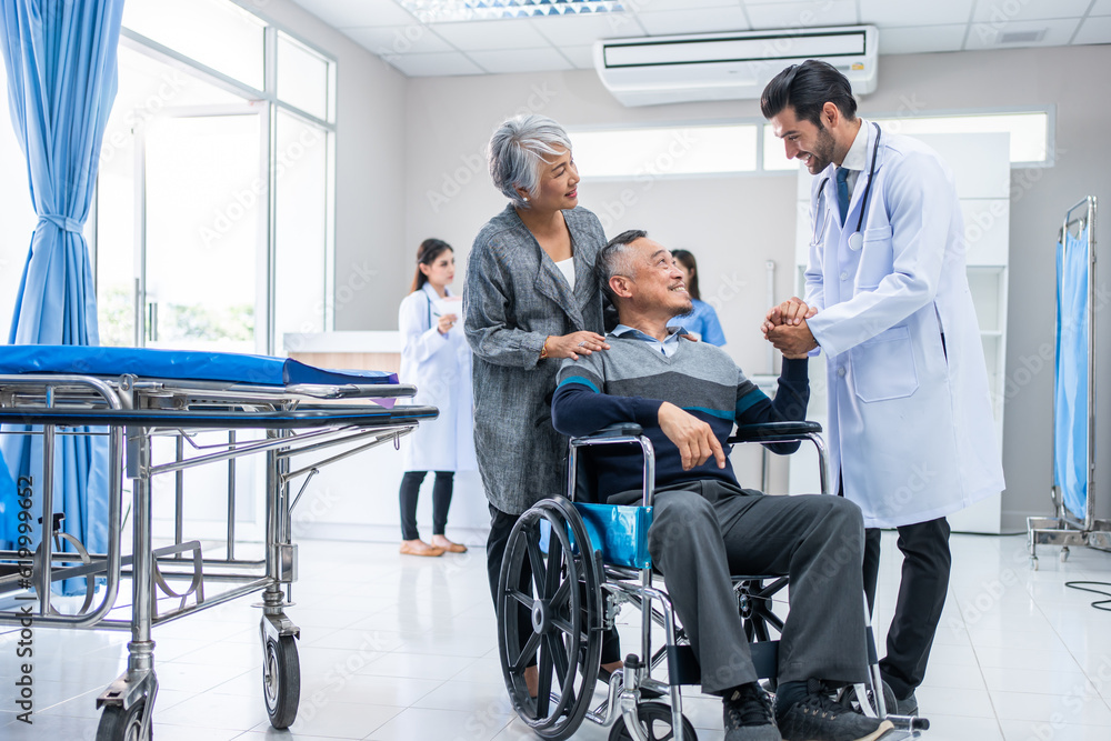 Mature doctor walking through the hallway to visit patient in hospital. Mature doctor walking through the hallway to visit patient in hospital.