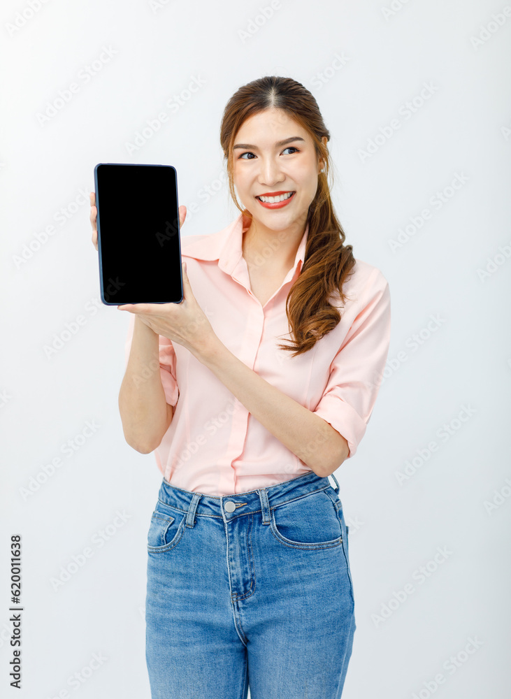 Portrait isolated cutout studio shot of Asian female businesswoman model in casual outfit standing smiling holding black blank screen tablet computer for copy space advertising on white background Portrait isolated cutout studio shot of Asian female businesswoman model in casual outfit standing smiling holding black blank screen tablet computer for copy space advertising on white background