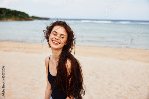 beach woman sea vacation smile space summer ocean sand nature copy young