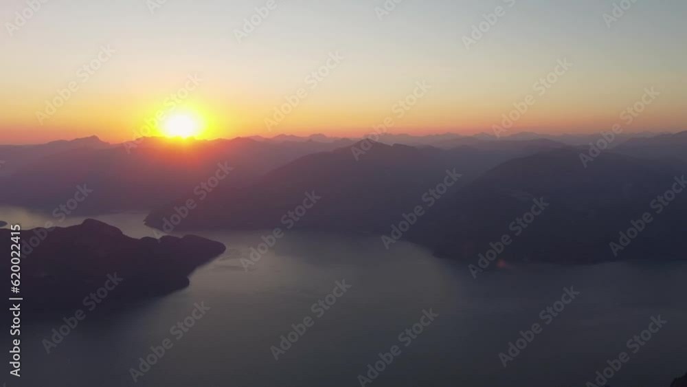 Beautiful Sunset Over Hazy Mountain Landscape with Island and Fjord - Drone Pan Beautiful Sunset Over Hazy Mountain Landscape with Island and Fjord - Drone Pan