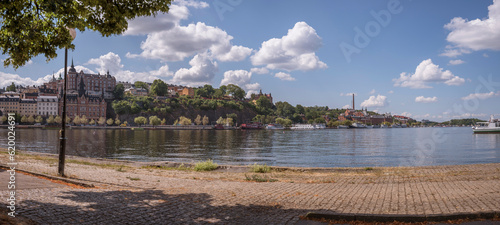 Panorama, pier bay view at the Riddarfjärden. Old 1700s houses at the hill Maria, the district Södermälarstrand, a sunny summer day in Stockholm