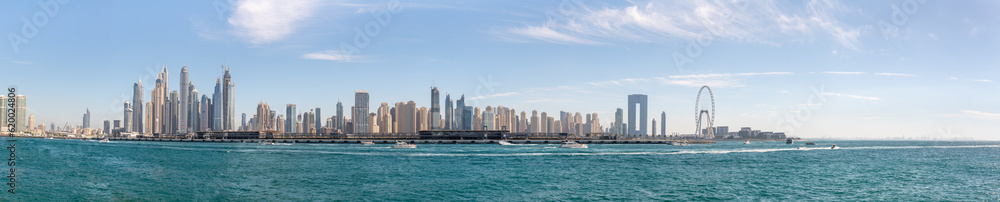 View from the window of the tourist bus to the architecture on Palm Jumeirah island in Dubai city, United Arab Emirates