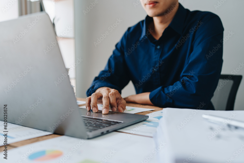 Businessman using computer laptop with planning working on financial document, tax, exchange, accounting and Financial advisor. Businessman using computer laptop with planning working on financial document, tax, exchange, accounting and Financial advisor.