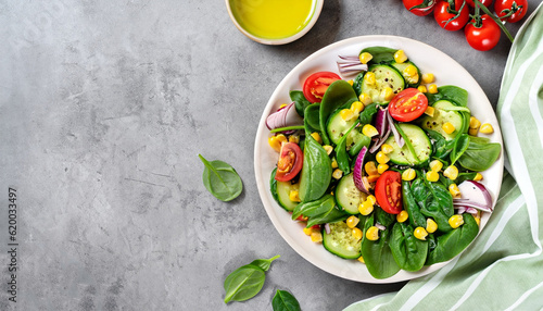 Fotografija Spring vegan salad with spinach, cherry tomatoes, corn salad, baby spinach, cucumber and red onion
