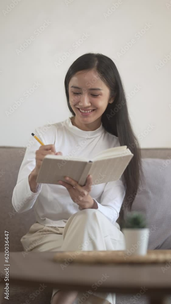 Asian business woman Hand writing ideas And taking notes Asian business woman Hand writing ideas And taking notes