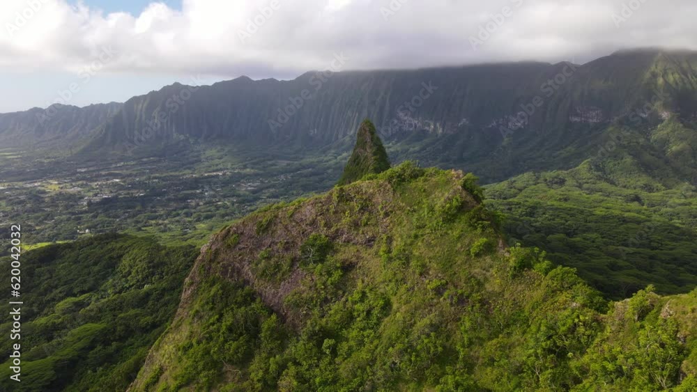 Aerial view of the Paku'i and Ahiki hills, Olomana Three Peaks Hiking Trail in the mountain range in Oahu, Hawaii Aerial view of the Paku'i and Ahiki hills, Olomana Three Peaks Hiking Trail in the mountain range in Oahu, Hawaii