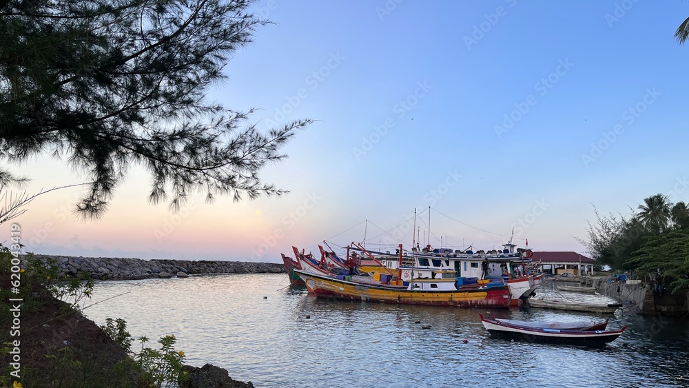 Fishing boats docked at the harbor waiting for departure at Samadua, South Aceh Indonesia 