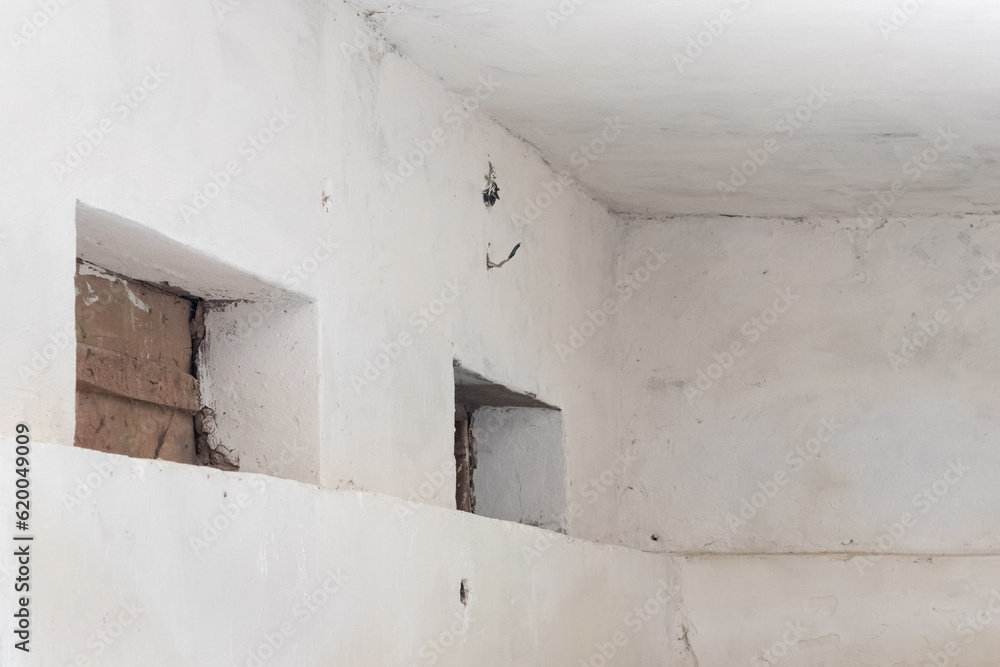 Basement with lime-whitewashed walls, design blank, copy space Basement with lime-whitewashed walls, design blank, copy space