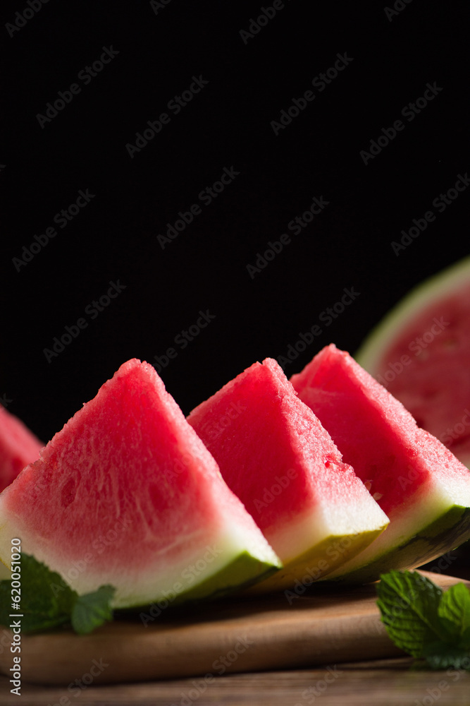 Fresh sliced watermelon on wooden background Fresh sliced watermelon on wooden background