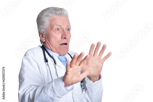portrait of surprised senior male doctor with stethoscope