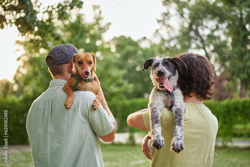 Support, care or happy family, men and kids bonding with foster puppy or pet and enjoying time together. High quality photo