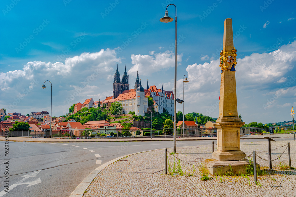 Famous ancient Meissen Castle, Fortress and Cathedral near Dresden at Elbe river with a Post Mile Column. Sunny summer day with blue sky