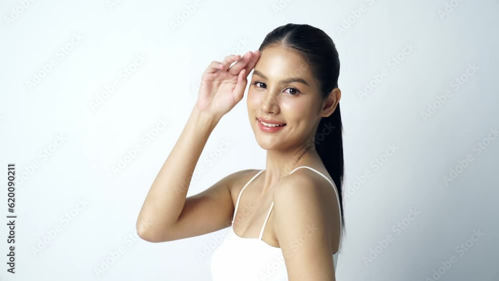 Beautiful Young asian Woman with Clean Fresh Skin on white background, Face care, Facial treatment, Cosmetology, beauty and spa, Asian women portrait Beautiful Young asian Woman with Clean Fresh Skin on white background, Face care, Facial treatment, Cosmetology, beauty and spa, Asian women portrait