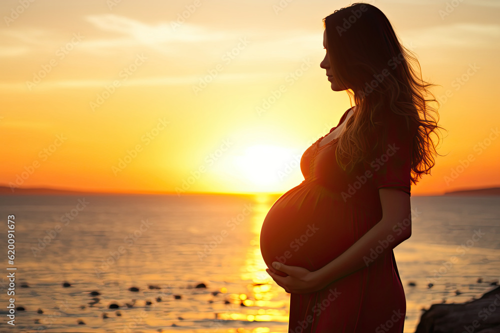 Pregnant woman at the beach during sunset Pregnant woman at the beach during sunset