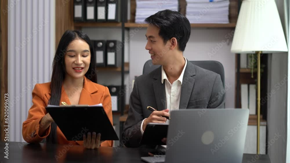 Asian business people discussing on performance revenue in meeting. businessman working with co-worker team. financial adviser analysing data with investor. Asian business people discussing on performance revenue in meeting. businessman working with co-worker team. financial adviser analysing data with investor.