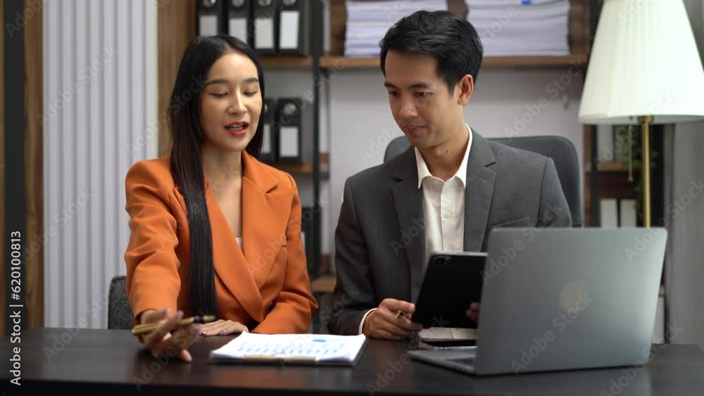 Asian business people discussing on performance revenue in meeting. businessman working with co-worker team. financial adviser analysing data with investor. Asian business people discussing on performance revenue in meeting. businessman working with co-worker team. financial adviser analysing data with investor.