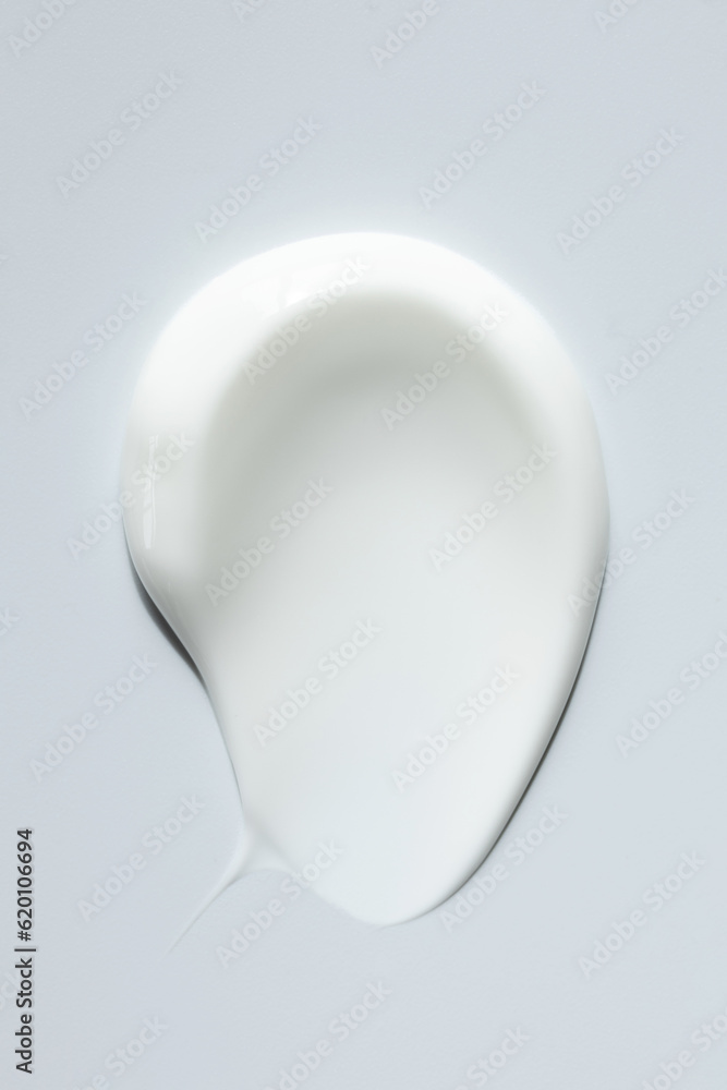 cosmetic smears of creamy texture on gray background cosmetic smears of creamy texture on gray background